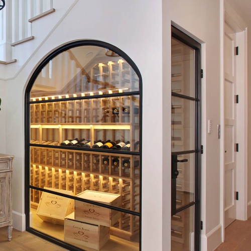 Custom glass and tile wine room under the stairs by Dunn's Flooring Depot Showroom & Design