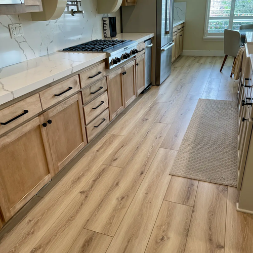 Flooring installation wide plank flooring in kitchen